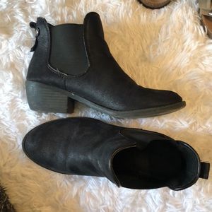 Slightly worn heeled boots